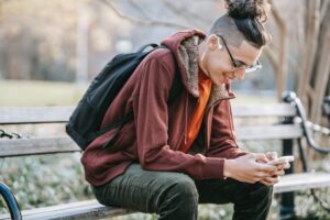 Reading Phone on Bench